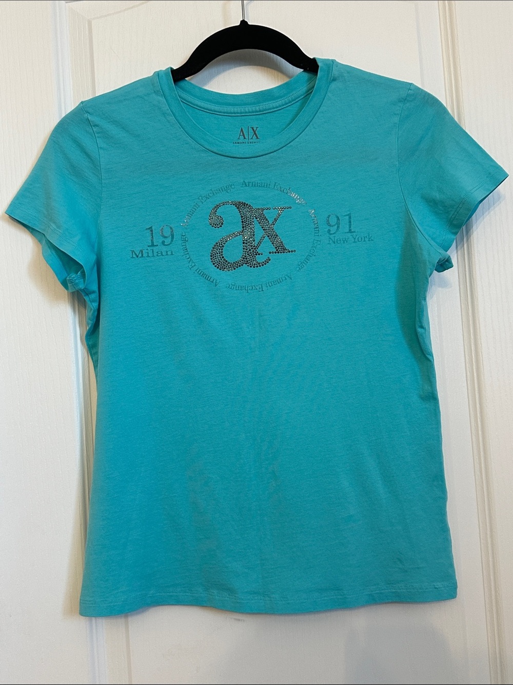 Armani Exchange t-shirt is a light blue, short-sleeved crewneck